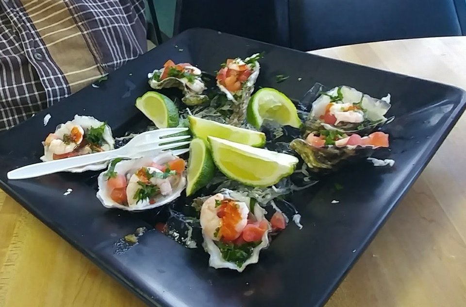 Colorful plates of fish and shrimp specials.
