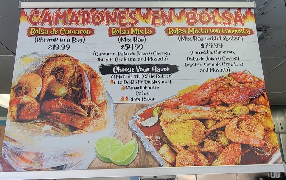 Printed menu featuring fish and shrimp dishes.