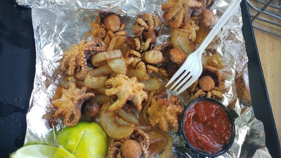 Seafood menu with caldo and tostadas.