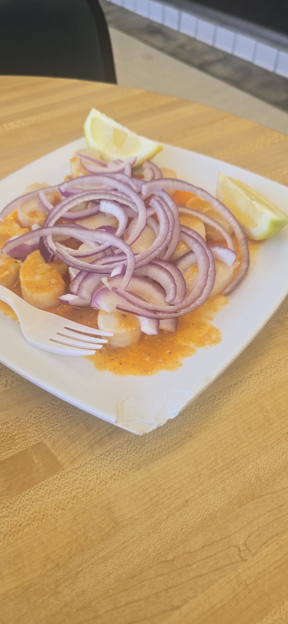Printed menu featuring fish and shrimp dishes.